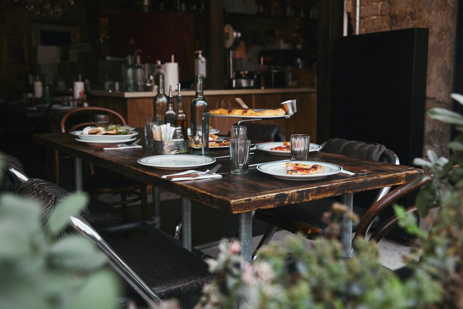 La Tavola Delicious Italian Meal On Rustic Table At Modern Restaurant